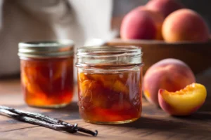 Vanilla and Nectarine Preserves in mason jars with vanilla beans