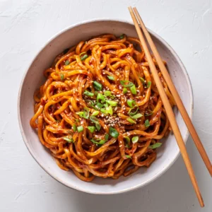 Gochujang Buttered Noodles in a bowl with scallions