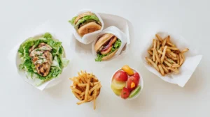 Fast food low FODMAP options – grilled chicken, lettuce wraps, small fries, fruit cup