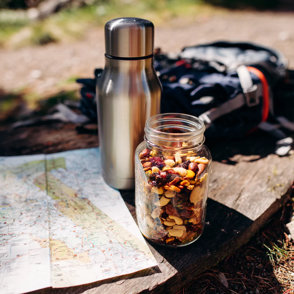 Jar of FODMAP friendly trail mix packed for a hiking trip