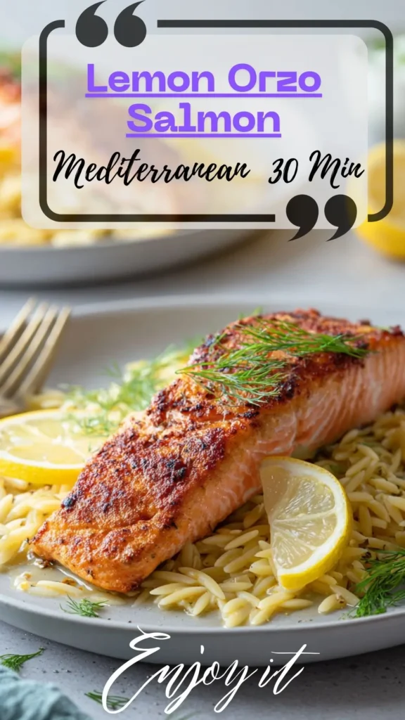 Side view of crisp salmon fillets over creamy lemon-spinach orzo in a skillet, herbs and lemon wedges on top.