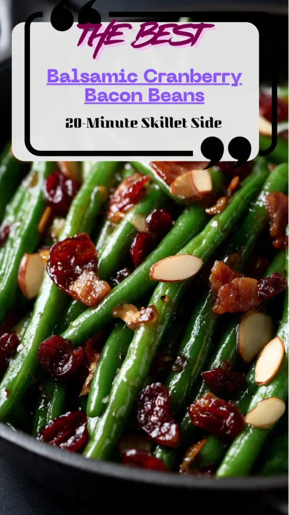 Skillet of glossy green beans with crisp bacon crumbles, chopped cranberries, and balsamic glaze; toasted almonds scattered; steaming hot side.