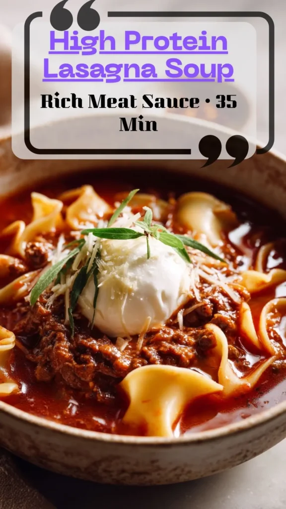 High Protein Lasagna Soup—curled noodles, rich meat sauce, ricotta dollop, basil. Lasagna Soup Recipe for Fall Soups.
