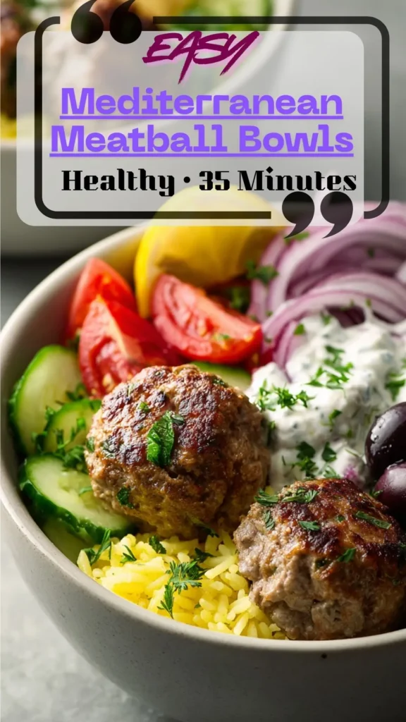 bowl with turkey meatballs, lemon rice, cucumbers, tomatoes, olives, greens, and tzatziki; healthy Mediterranean dinner.