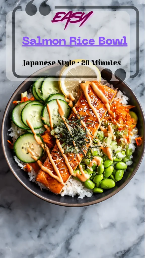 Overhead salmon rice bowl with crispy salmon, white rice, cucumber, avocado, carrot, edamame, scallions, sesame, and sriracha-mayo drizzle.