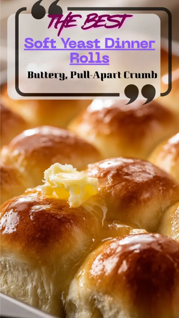 Soft yeast dinner rolls, golden and butter-brushed; pull-apart texture on baking tray, Homemade Yeast Rolls.