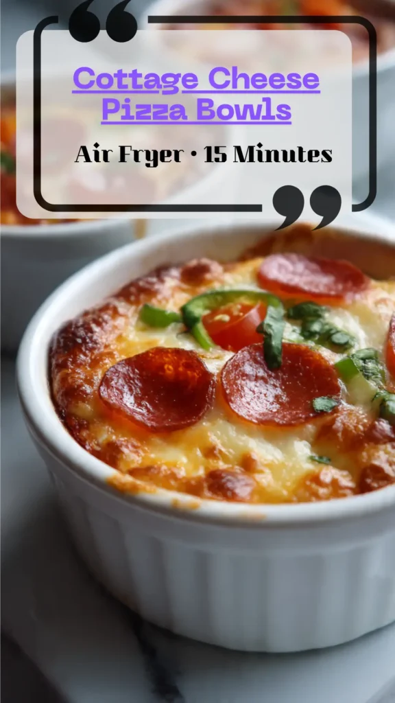 Side view ramekin of cottage-cheese pizza bowl—bubbly browned cheese, red sauce, pepperoni and peppers; high-protein, low-carb air-fryer dinner.