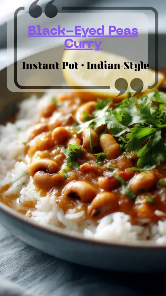 Side view bowl of creamy Indian black-eyed peas curry—tomato masala, coconut finish, cilantro garnish; warm, glossy sauce over rice.