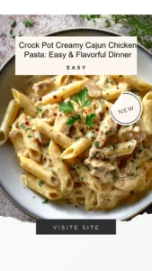 Crock pot creamy Cajun chicken pasta served in a bowl with herbs and spices