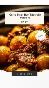 Garlic butter beef bites served with potatoes on a plate.