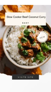 Slow cooker beef coconut curry served in a bowl with fresh herbs and rice