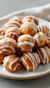 Gooey Sourdough Discard Cinnamon Roll Bites on a plate