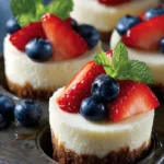 Delicious mini cheesecakes topped with fresh fruit and chocolate.