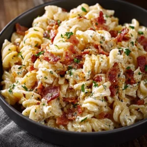 Creamy bacon cheddar ranch pasta salad in a vibrant bowl with fresh ingredients