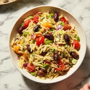 Colorful Greek Orzo Salad with feta cheese and fresh vegetables