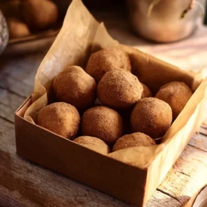 Delicious Irish Potato Candy displayed on a plate