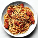 One-Pan Sun-Dried Tomato Pasta cooked in a skillet with fresh ingredients