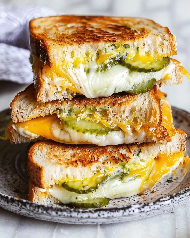 Delicious pickle grilled cheese sandwich with melted cheese and pickles