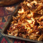 Delicious Slow Cooker Chicken Carnitas Tacos served with fresh toppings