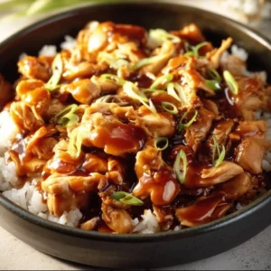 Delicious Slow Cooker Honey Teriyaki Chicken served with rice and veggies