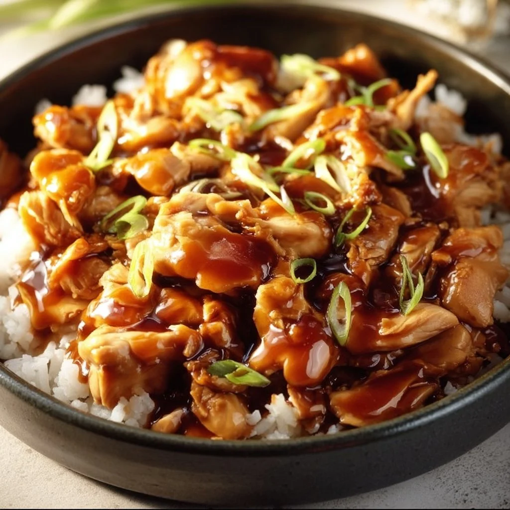 Delicious Slow Cooker Honey Teriyaki Chicken served with rice and veggies