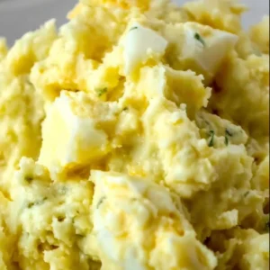 Delicious Southern Potato Salad served in a bowl at a summer picnic