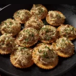 Tuna crackers snack with a side of fresh vegetables and a dipping sauce