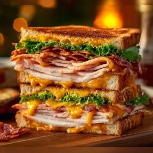 Ultimate cowboy club sandwich with layers of meat and fresh ingredients