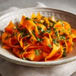 Colorful Carrot Ribbon Salad with fresh vegetables and dressing