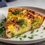 Crustless quiche with ham, broccoli, and cheese served in a dish