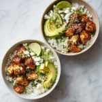 Honey Lime Chicken served in a bowl with avocado rice and fresh ingredients