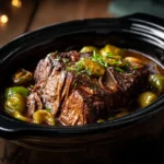 Delicious Mississippi Pot Roast served in a rustic bowl with herbs