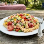 Delicious Pink Cadillac Pasta Salad in a bowl, perfect for picnics.