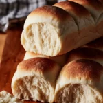 Freshly baked sourdough hot dog buns made with tangzhong technique.
