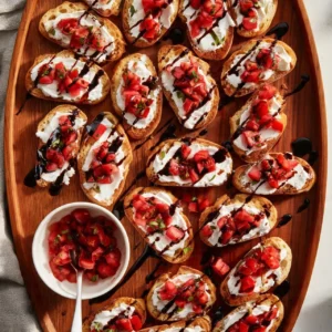 Three Cheese Bruschetta topped with flavorful cheeses and fresh herbs