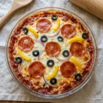 Cottage Cheese Pizza Bowl topped with Pepperoni on a wooden table