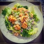 High-Protein Buffalo Chicken Salad with fresh vegetables and grilled chicken