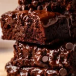 High-protein chocolate banana bread slice served on a plate with chocolate chips.