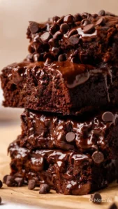 High-protein chocolate banana bread slice served on a plate with chocolate chips.