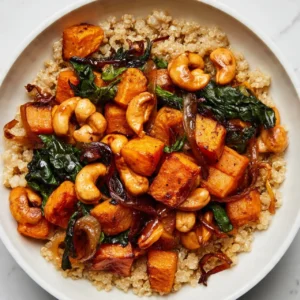 Warm Spinach Salad with Roasted Vegetables in a bowl
