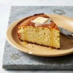 Deliciously baked buttermilk cornbread served on a rustic wooden table