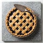Classic blueberry pie topped with crispy oats, served on a rustic plate.