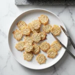 Crispy salt and vinegar cottage cheese chips on a plate, delicious and healthy snack.