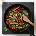 Delicious grilled steak fajitas served with colorful peppers and onions