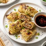 Delicious pan-fried cabbage dumplings filled with ground meat.