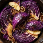 Sautéed red cabbage cooked with spices and served in a skillet
