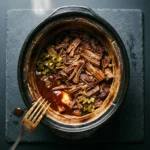 Delicious slow cooker pulled BBQ beef sandwiches served on fresh buns