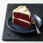 Delicious Southern Red Velvet Cake slice with cream cheese frosting