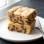 Delicious no bake cookie dough bar topped with chocolate chips and sprinkles