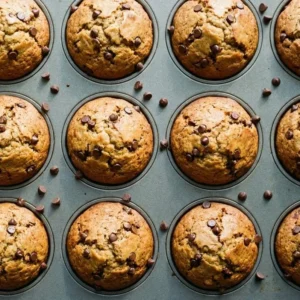 Healthy peanut butter banana muffins baked golden brown in a muffin tin